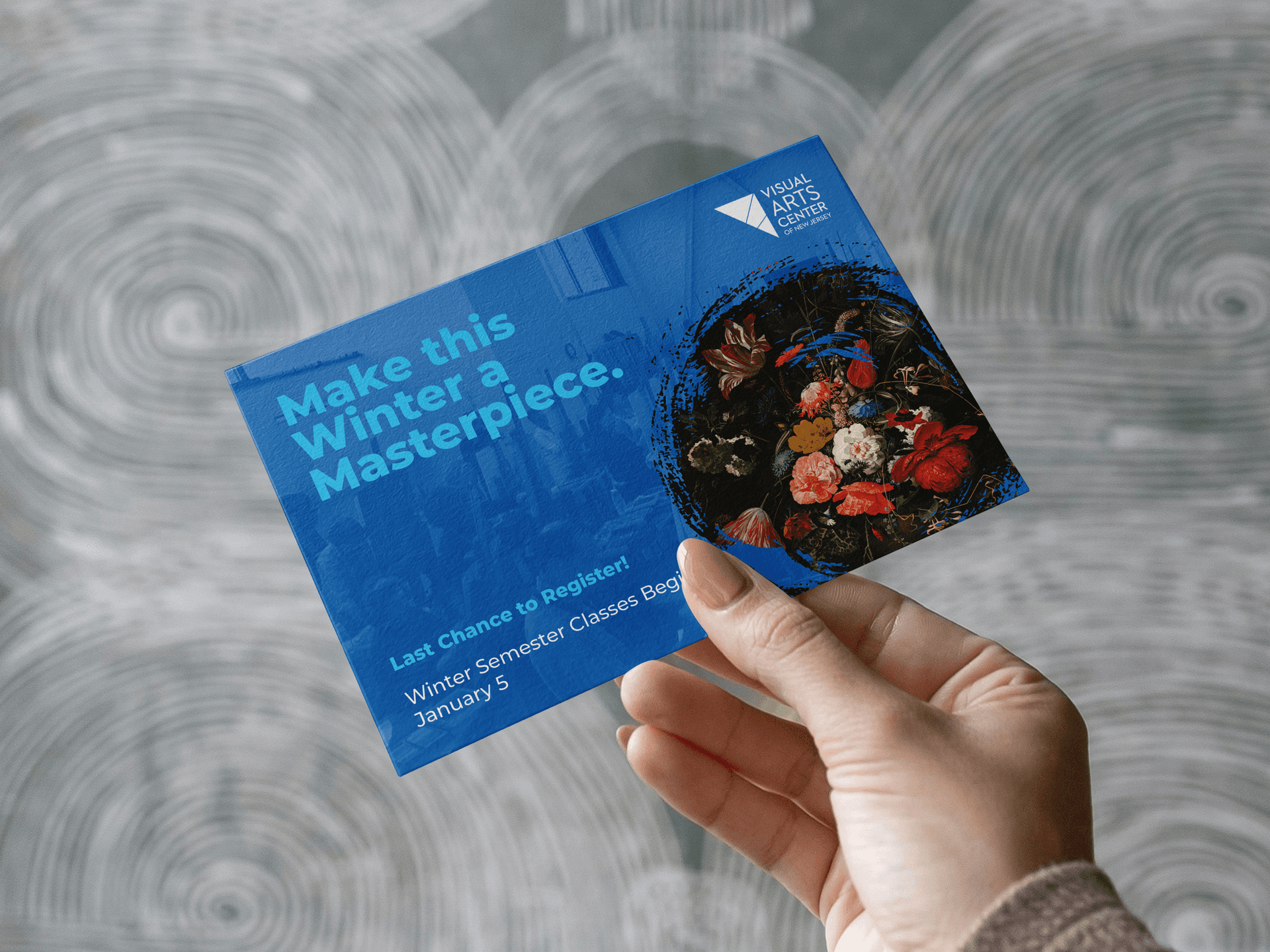 A seasonal postcard held in hand